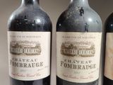 three bottles of wine sitting on top of a table next to each other