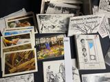 a lot of postcards on the table with pictures