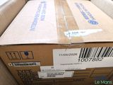 a cardboard box with a barcode on it sitting on the floor