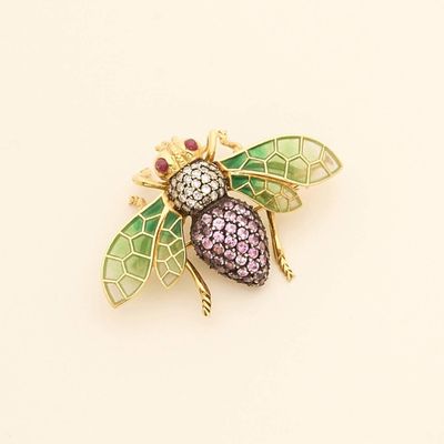 an image of a bee brooch with pink, green and purple stones