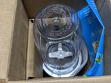 a box with a blender inside of it on the floor