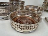 a lot of silver dishes that are on the table