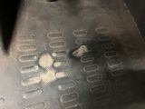 a dog paw print on the floor of a car