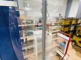 a glass display case in the middle of a room