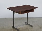 a close up of a small table with a drawer on it