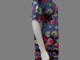 the mannequin is wearing a dress with flowers on it