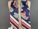 a close up of a mannequin torso with a scarf on it