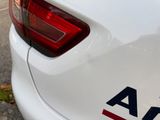 a close up of a white car with the american flag on it