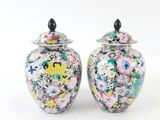 two vases that have been decorated with flowers on them