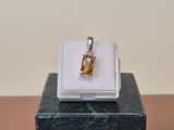 an image of a ring with a yellow stone in it