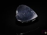 an image of a piece of rock on a black surface