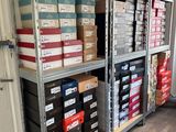 a lot of boxes on the shelves in the room