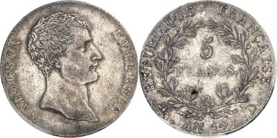 a silver coin with an image of a man on it