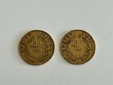 two gold coins, one of which has a crown and the other of which has a crown on it