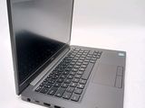 a laptop computer that is sitting on a white surface