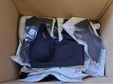 two bras in a box with plastic wrap around them