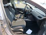 the interior of a car with the door open and the seats down