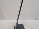 a close up of a tablet computer on a stand on a white surface