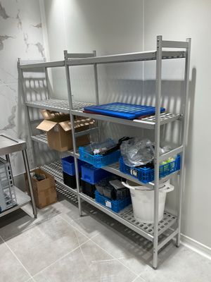 a metal shelving with a lot of items on it