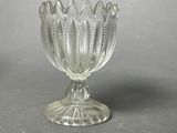 a glass bowl that is sitting on a table