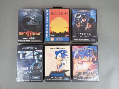 six boîtes de jeux vidéo sont alignées sur une table