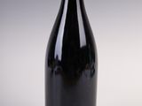 a bottle of wine that is sitting on a table
