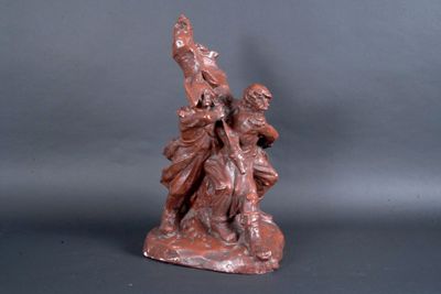 statue of a woman with a bird on her shoulder and a man on a horse