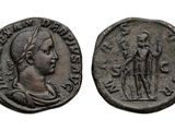 an ancient coin with a woman and a man on it