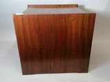 a wooden box that is sitting on a white surface