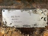a metal plaque on the side of a building