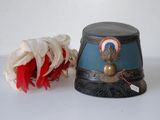 a hat and a flower sitting on a table