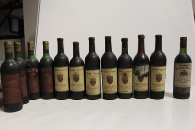 several bottles of wine are lined up in a row on a table