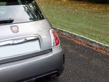 a small car that is parked on the side of the road