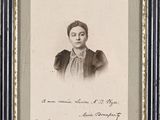 an old photo of a woman in a black and white photo