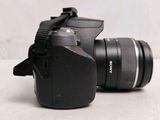 a camera with a lens attached to it on a table
