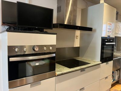 an image of a modern kitchen with stainless steel appliances