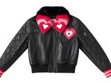 a black leather jacket with hearts on the collar and cuffs