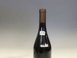 a bottle of wine that is sitting on a table