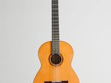 an image of a guitar hanging on a wall
