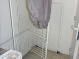 an image of a clothes rack in a small room
