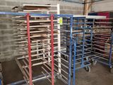 many racks with trays of food on them in a warehouse