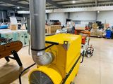 a yellow machine that is sitting inside of a building