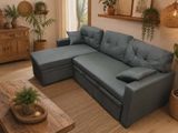 a living room with a blue couch and a coffee table