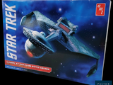 a box with a model of a star trek ship in it