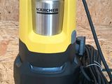 a yellow and black machine on a wooden surface