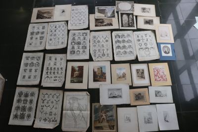 a lot of drawings and pictures on the table