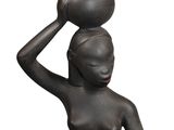 statue of a woman carrying a pot on her head
