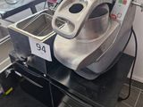 a machine that is sitting on a counter in a kitchen