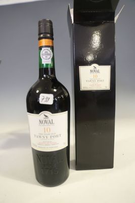 a bottle of wine that is next to a box