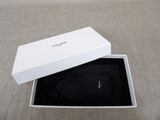 a white box with a black bag inside of it